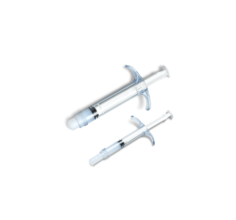 Two types of NanoBone® SBX Putty syringes that are used for placement into larger open wounds.